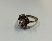 A 9 carat cluster ring. Approx. 2 grams. Est. £50
