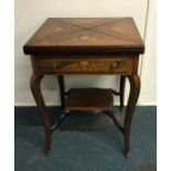 An attractive envelope card table. Est. £150 - £25