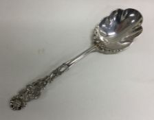 A heavy cast silver spoon in the form of a rose. A