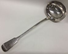 A large heavy George III silver soup ladle. London