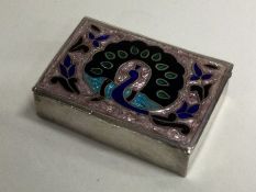 A silver and enamel hinged top box decorated with