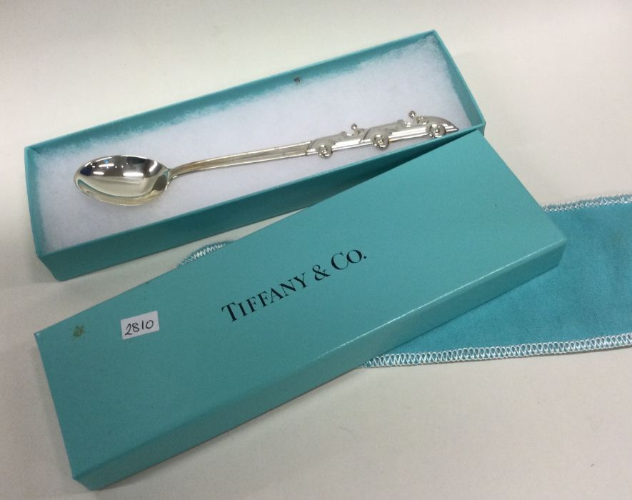 TIFFANY & CO: A cased silver christening spoon in