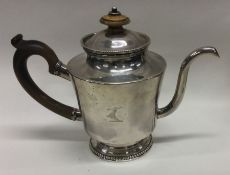 An 18th Century silver Argyle of plain form with crested side