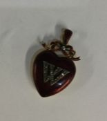 An unusual Victorian 18 carat gold heart shaped pe