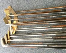 A large collection of steel handled golf putters a