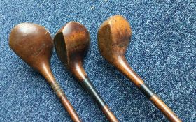 A wooden handled HICKORY golf driver by T G Renduf