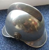 A 20th Century German nickel plated fire helmet. E