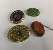 A good Chinese oval carved brooch with ball decora