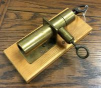 An unusual brass alarm gun. Est. £20 - £30.