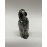 A silver pepper in the form of an owl. Marked to s