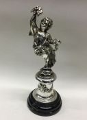 A silver plated figure of a winged infant. Est. £3