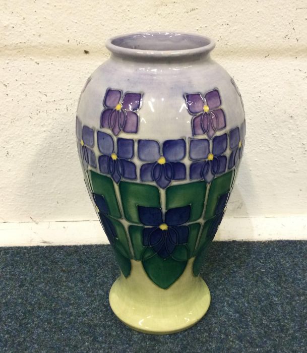 MOORCROFT: A boxed vase decorated in bright colour