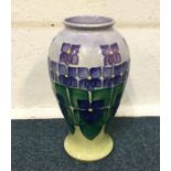 MOORCROFT: A boxed vase decorated in bright colour