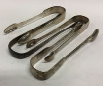 A selection of four 19th Century silver sugar tong