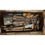 A metal box containing old tools. Est. £10 - £20.