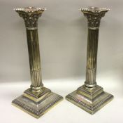 A good pair of silver gilt Corinthian column candl