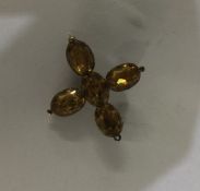 An Antique five stone cross set in gold. Approx. 6