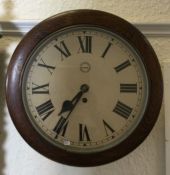 A good oak wall clock with white enamelled dial. E