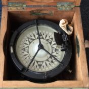 A cased ship's compass of typical form. Est. £10 -