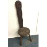 A carved oak hall chair. Est. £20 - £30.