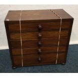 A mahogany five drawer apprentice chest. Est. £50