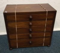 A mahogany five drawer apprentice chest. Est. £50