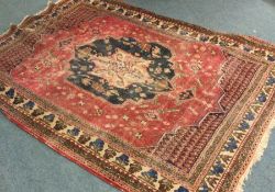 An old tapestry rug. Est. £30 - £40.