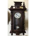 A mahogany cased wall clock. Est. £20 - £30.