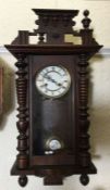 A mahogany cased wall clock. Est. £20 - £30.