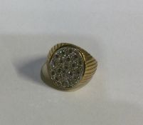 A gold and diamond mounted ring of oval form. Appr