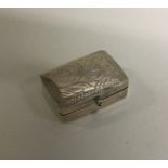 An engraved silver box with hinged top. Est. £8 gr