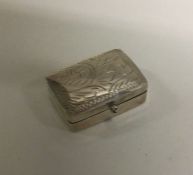 An engraved silver box with hinged top. Est. £8 gr