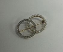 An attractive Victorian pearl and diamond brooch i
