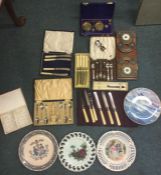 A selection of cased cutlery sets, decorative plates etc.
