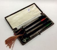 A set of four Sterling silver pencils in case. App