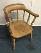 A pine bow back chair. Est. £30 - £40.