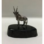PATRICK MAVROS: A silver figure of an antelope on