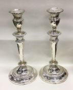 A pair of large George III silver candlesticks. Lo