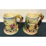 A pair of musical pottery tankards. Est. £30 - £50