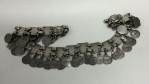 A heavy Continental silver tassel belt. Approx. 21