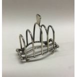 CHESTER: A small unusual silver toast rack. 1902.