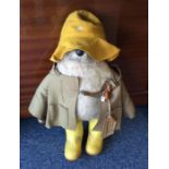 An original Paddington Bear wearing Dunlop wellies