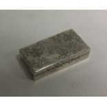 A Japanese silver box with engraved decoration. Si