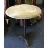 A small cast iron based pub table. Est. £25 - £35.
