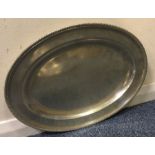 A large oval Georgian silver dinner plate with cre