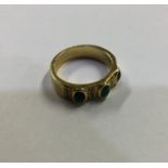 A good 18 carat gold emerald and diamond ring. App