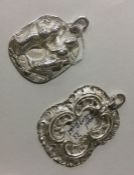 Two heavy Chinese silver pendants. Est. £30 - £40.