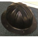 A German hard hat. Est. £20 - 330.