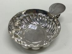 A late 19th Century French silver wine taster with