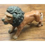 A large spelter figure of a lion. Est. £10 - £20.